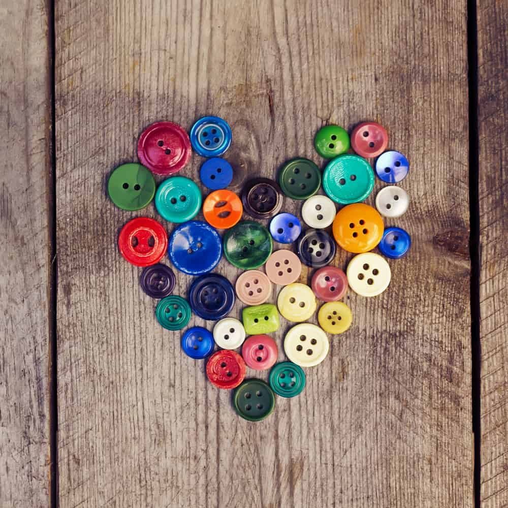 button heart with wood background
