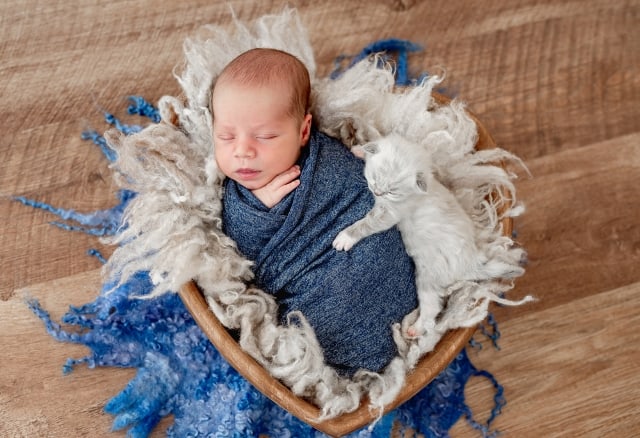 baby sleeping in a wrapped blanket