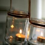 Aromatic candles in glass jars hanging