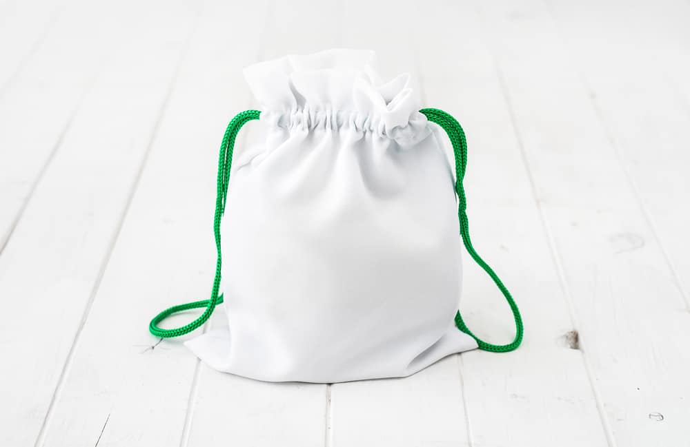Full white gift bag with green ties