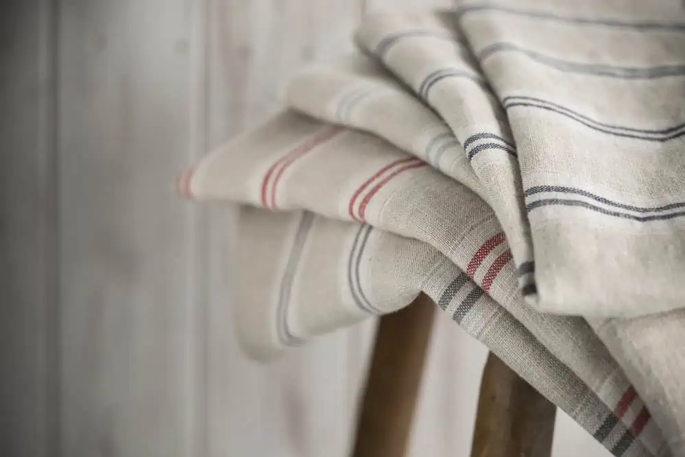 List of Sustainable Materials: An In-Depth Exploration 10 Stack of Striped Linen